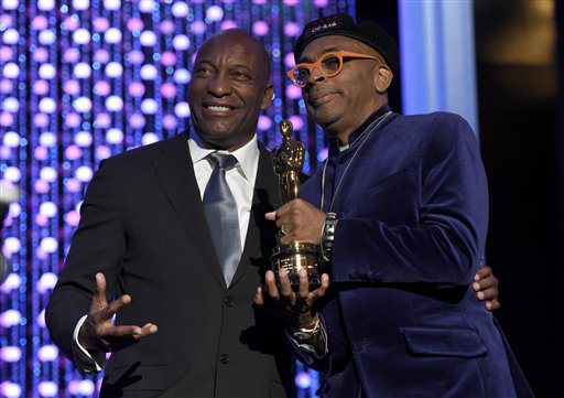 John Singleton, left, and Spike Lee, honorary Oscar recipient, pose onstage at the Governors Awards at the Dolby Ballroom on Saturday, Nov. 14, 2015, in Los Angeles. (Photo by Chris Pizzello/Invision/AP)