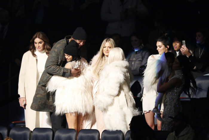 Lamar Odom, second left, hugs Kylie Jenner as Caitlyn Jenner, left, Khloe Kardashian Odom, center, Kim Kardashian, Kendall Jenner, North West and Kourtney Kardashian (both out of spotlight) attend the unveiling of the Yeezy collection and album release for Kanye West's latest album, "The Life of Pablo," Thursday, Feb. 11, 2016 at Madison Square Garden in New York. (AP Photo/Bruce Barton)