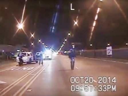 FILE - In this Oct. 20, 2014 frame from dash-cam video provided by the Chicago Police Department, Laquan McDonald, right, walks down the street moments before being shot by officer Jason Van Dyke in Chicago. Van Dyke, who shot McDonald 16 times, was charged with first-degree murder Tuesday, Nov. 24, 2015. The video has no sound, nor do videos from four other squad cars at the scene. But police protocol indicates that all the cruisers should have been recording audio that night. (Chicago Police Department via AP, File)